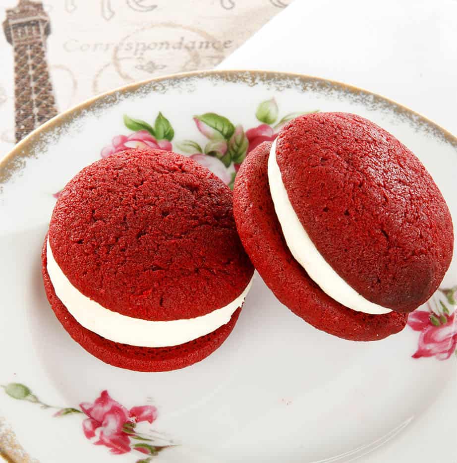 Square picture of red velvet cake on a Victorian style cake plate