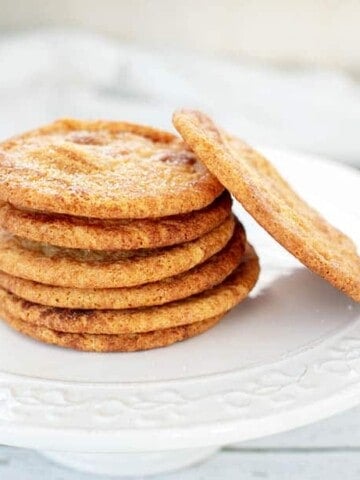 Caramilk Snickerdoodle Cookies in a stack on a white platter