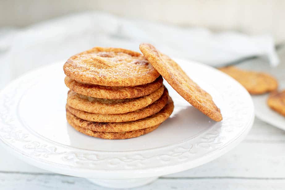 Caramilk Snickerdoodle Cookies in a stack on a white platter