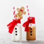 Image of milk bottles dress as Santa for Christmas