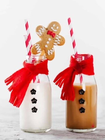 Image of milk bottles dress as Santa for Christmas