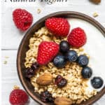 Natural Yoghurt in a bowl with berries and granola, white background