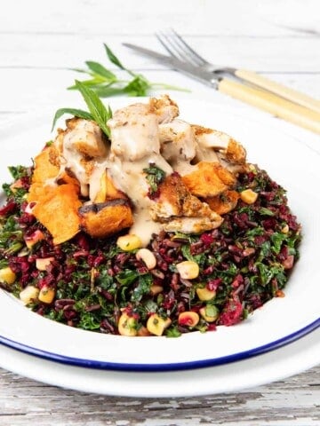 Portrait image Black rice chicken salad bowl on white background