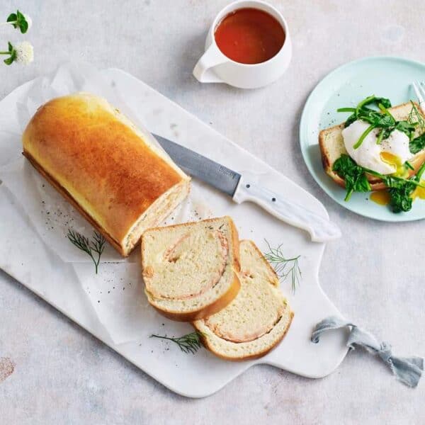 Brioche on a table with a side salad