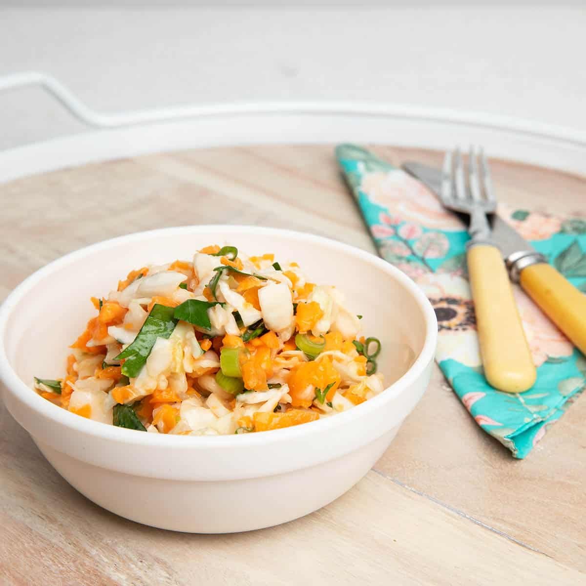 Thermomix Coleslaw in a bowl on a wooden background