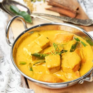 Thermomix vegetable curry in an Indian bowl with dried spices