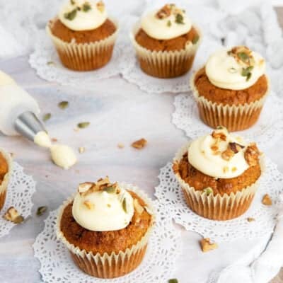 Carrot cupcakes thermomix on a white board with a frosting bag