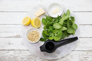 Pesto Sauce Ingredients on a wooden chopping board