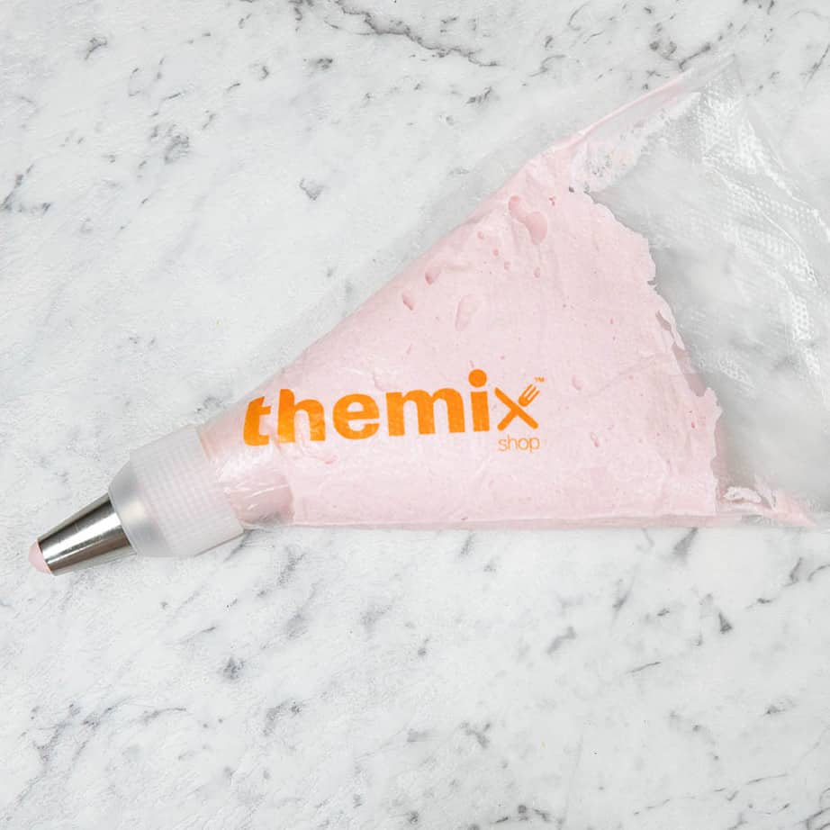 The Mixshop printed disposable piping bag on a marble background