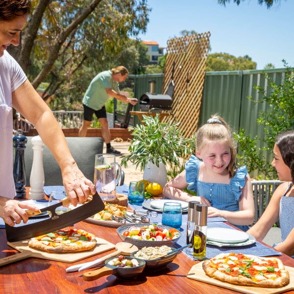 Thermomix Pizza Oven- family enjoying pizza night