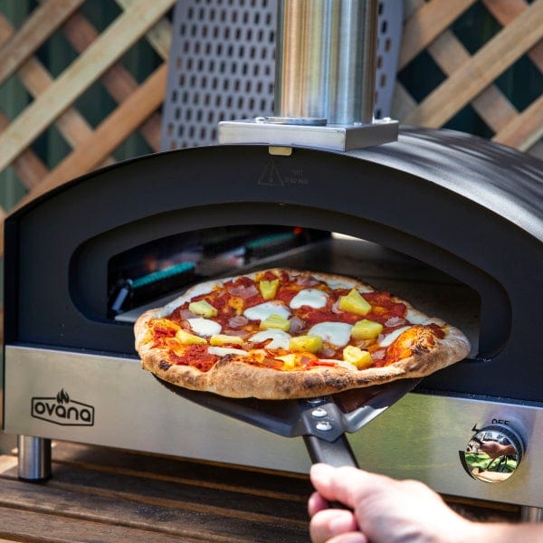 Ovana Portable Pizza Oven and pizza on a peel