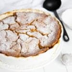 Thermomix Butterscotch Pudding on a white background with a serving spoon