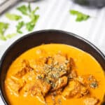 Madras Lamb Curry Thermomix recipe on striped background