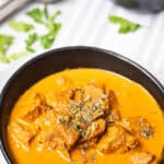 Madras Lamb Curry Thermomix recipe on striped background