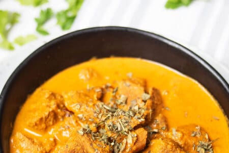 Madras Lamb Curry Thermomix recipe on striped background