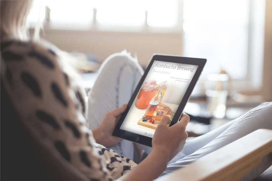 Kombucha Brewing eBook being read on an iPad by a person