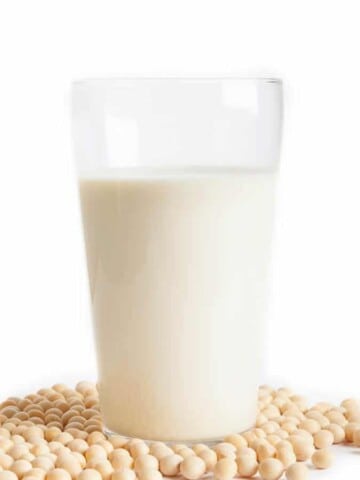Homemade Soy milk in a glass on white background