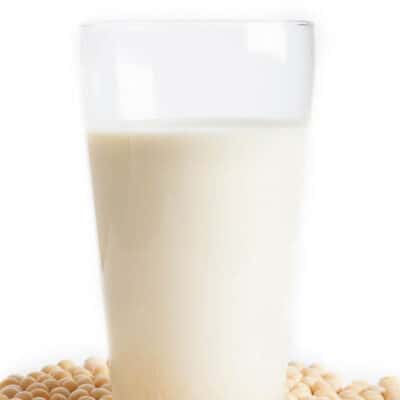 Homemade Soy milk in a glass on white background