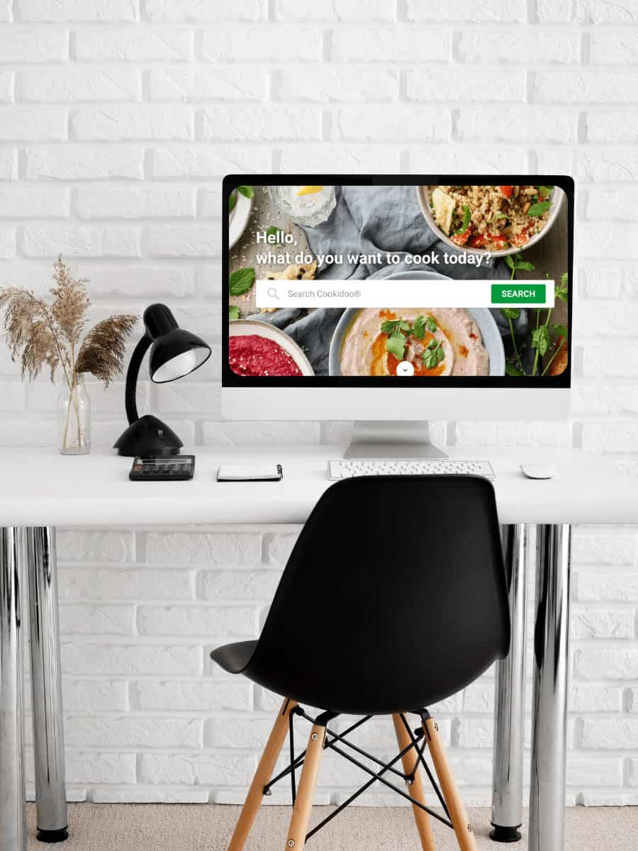 Cookidoo Workshop on computer Desk with a chair in a white room