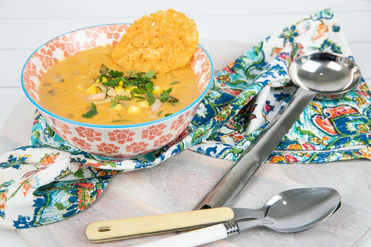 Mexican Chicken soup in a coloured bowl with patterned napkin