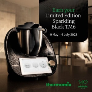 Sparkling Black thermomix on a bench with an incentive advertisement