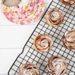 Overhead image of apple pastries with a cup of tea.