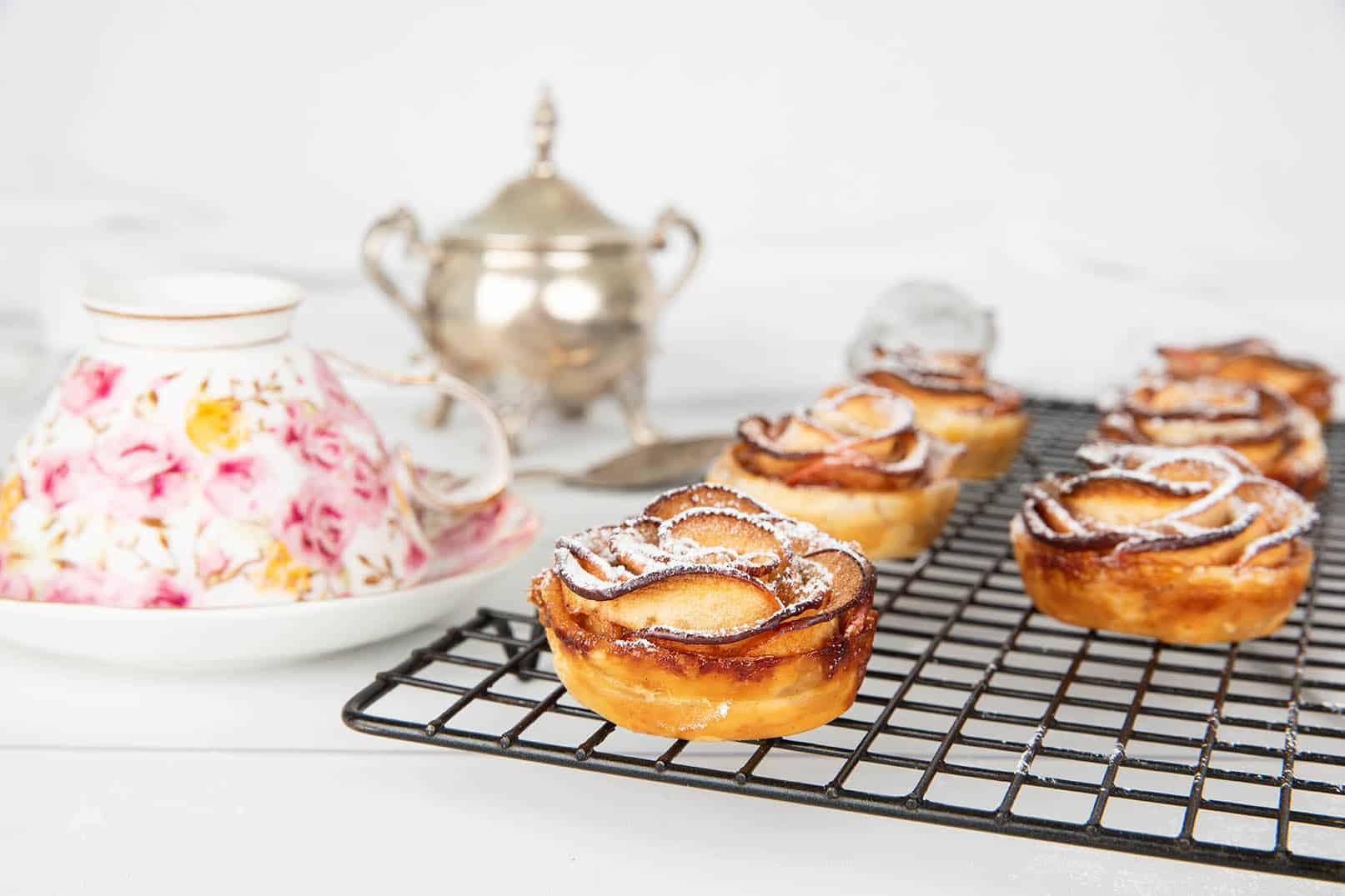 Apple Pastry Tart on a tray with tea cup.