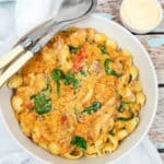 Tuscan Chicken with pasta in a large white bowl