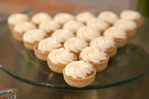 Mini Banoffee Tarts shown in a perfect triangle.