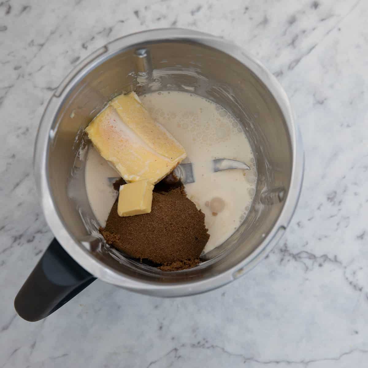 Thermomix bowl with the caramel sauce ingredients ready to heat. Progress shot.