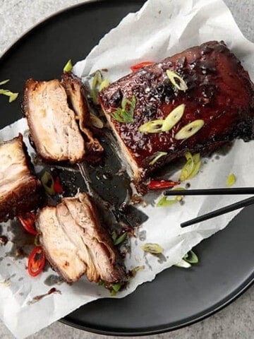 Glazed Twice Cooked Pork Belly on a black background- Main meals profile Pic
