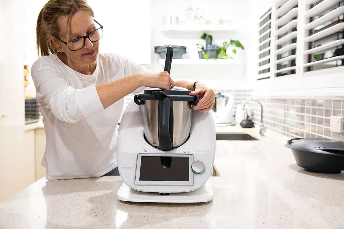 Julie Carlyle with a white TM6 Thermomix cooking.