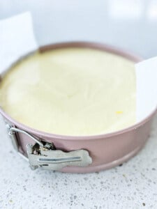 mango cheesecake mixture in the springform tin.