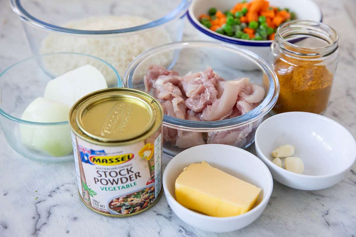 Ingredients for the curried chicken risotto on a marble benchtop