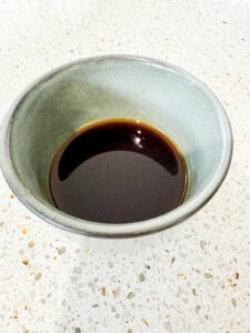 Homemade Teriyaki sauce in an earthen wear dish.