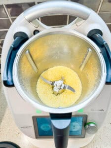 Grated Parmesan cheese in the Thermomix bowl