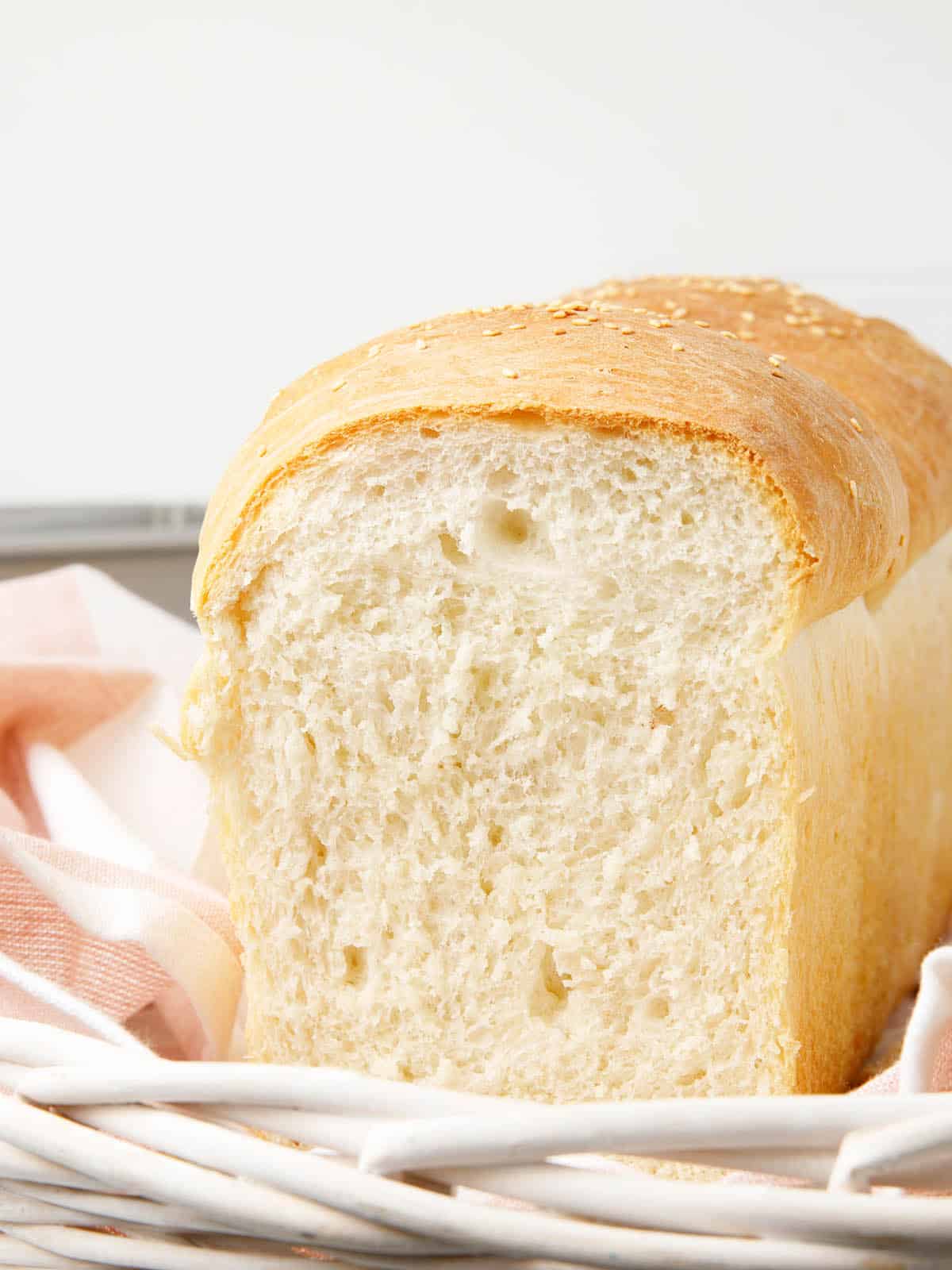Thermomix bread on a pink striped tea towel and white background