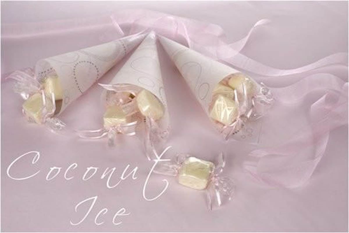 Cranberry Coconut Ice wrapped as a lolly on a pink background