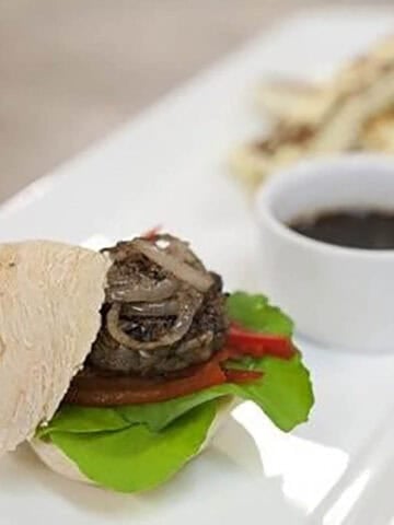 Mouse Burger on a white serving plate with a demi glaze