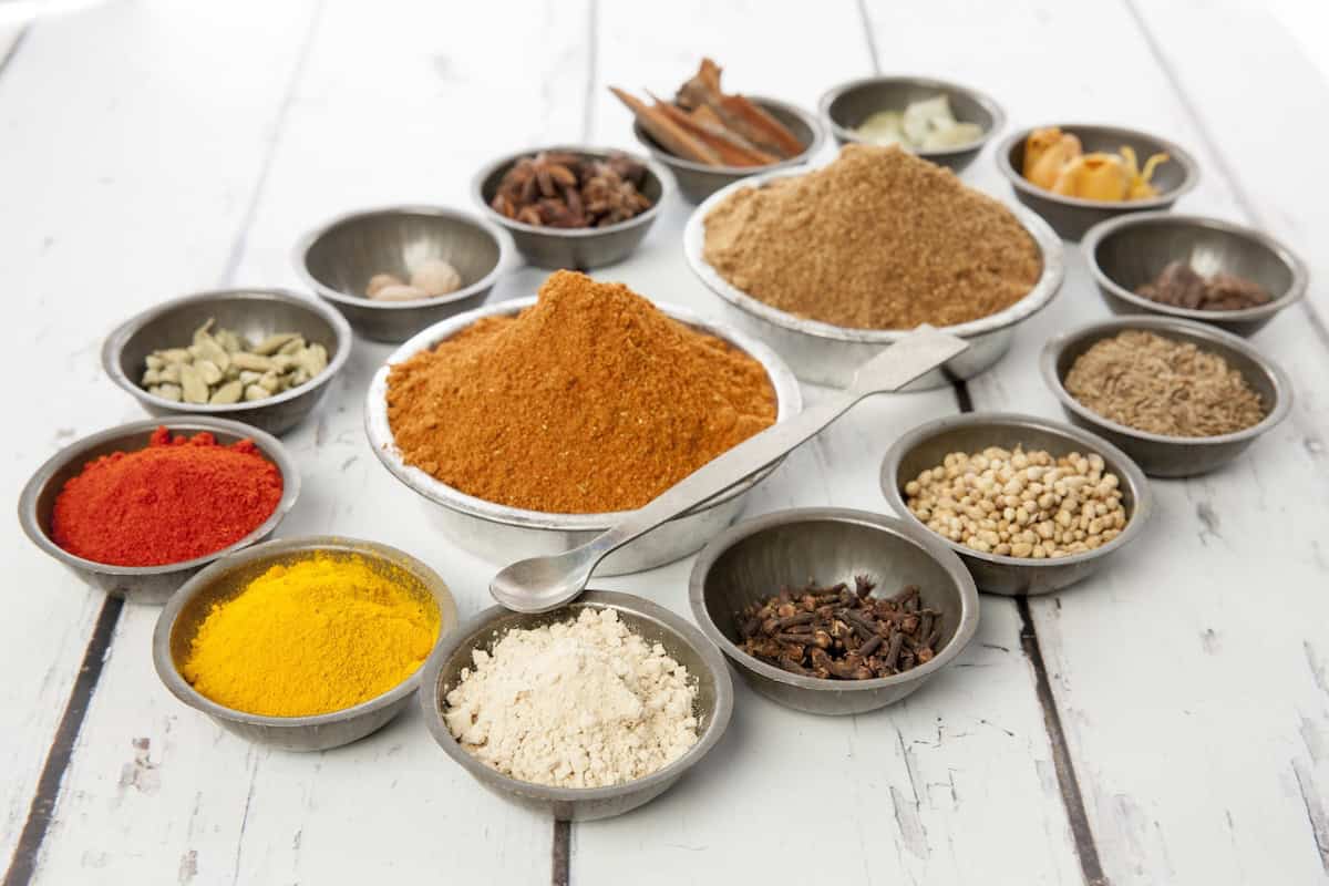 Thermomix Kitchen Garam Masala spices arranged in little bowls on a white background