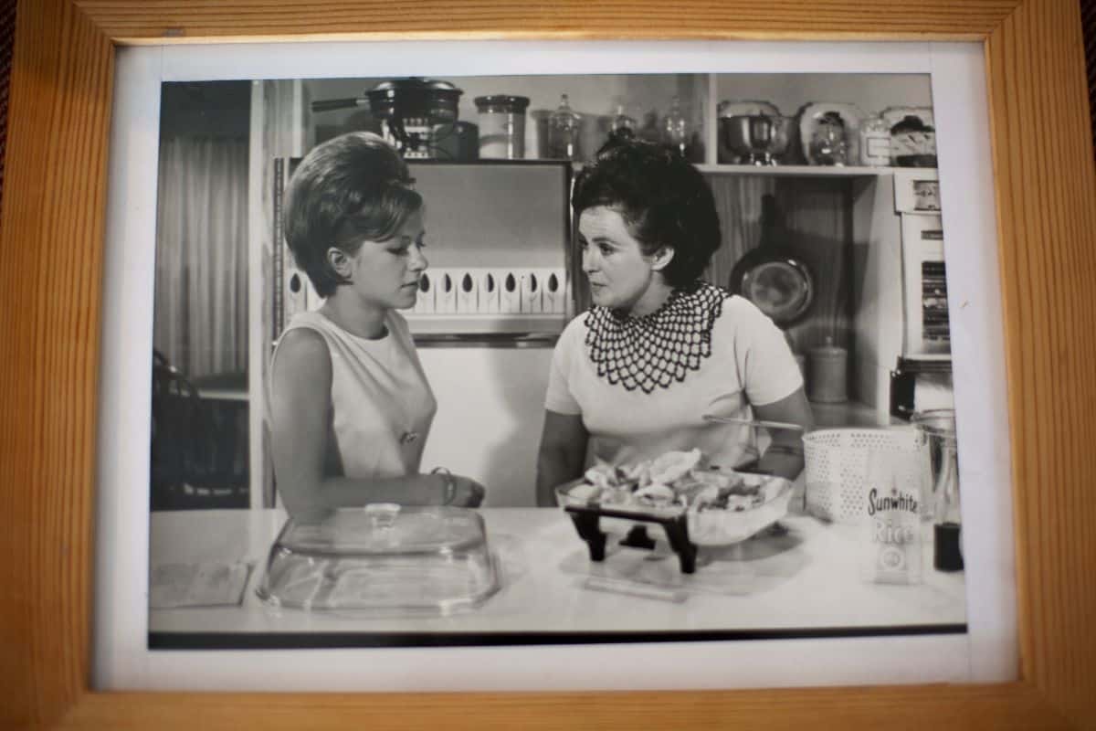 A young Suzanne Gibbs cooking with her mother, Margaret Fulton, in a photograph displayed in Suzanne&rsquo;s family home.