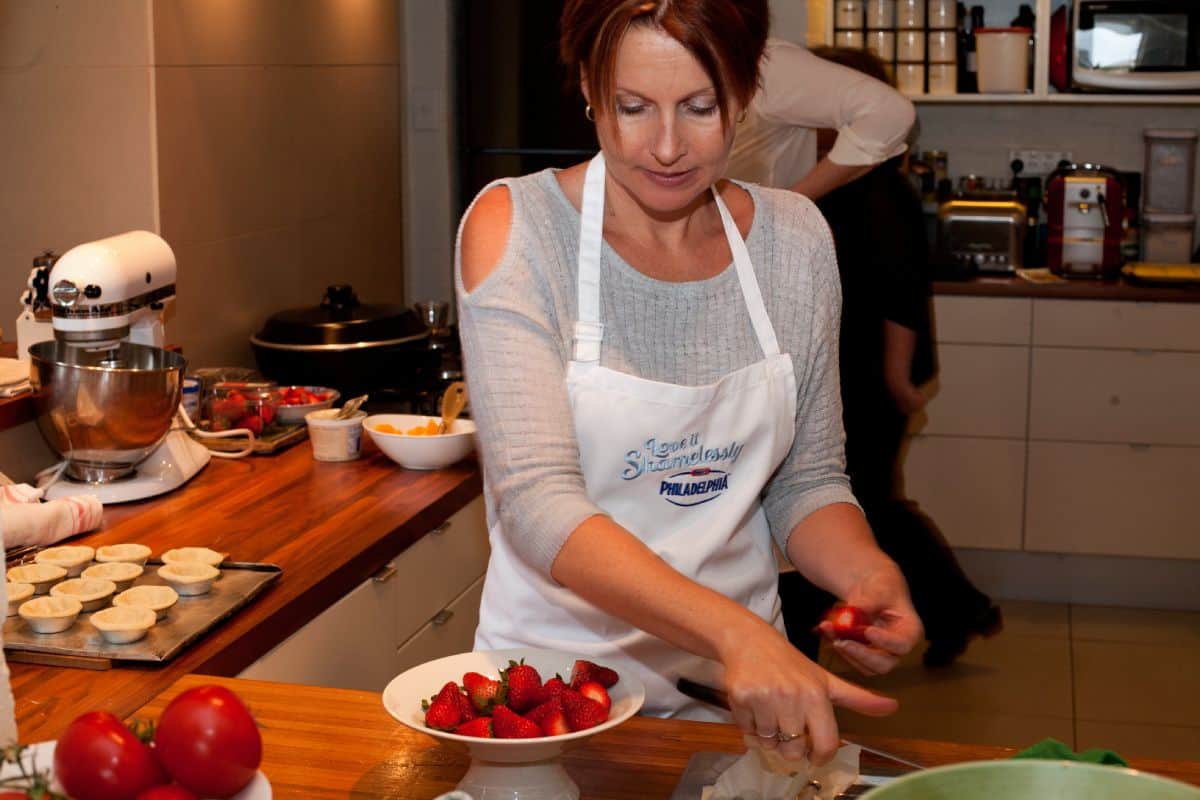 Julie Carlyle cooking in Suzanne Gibbs home