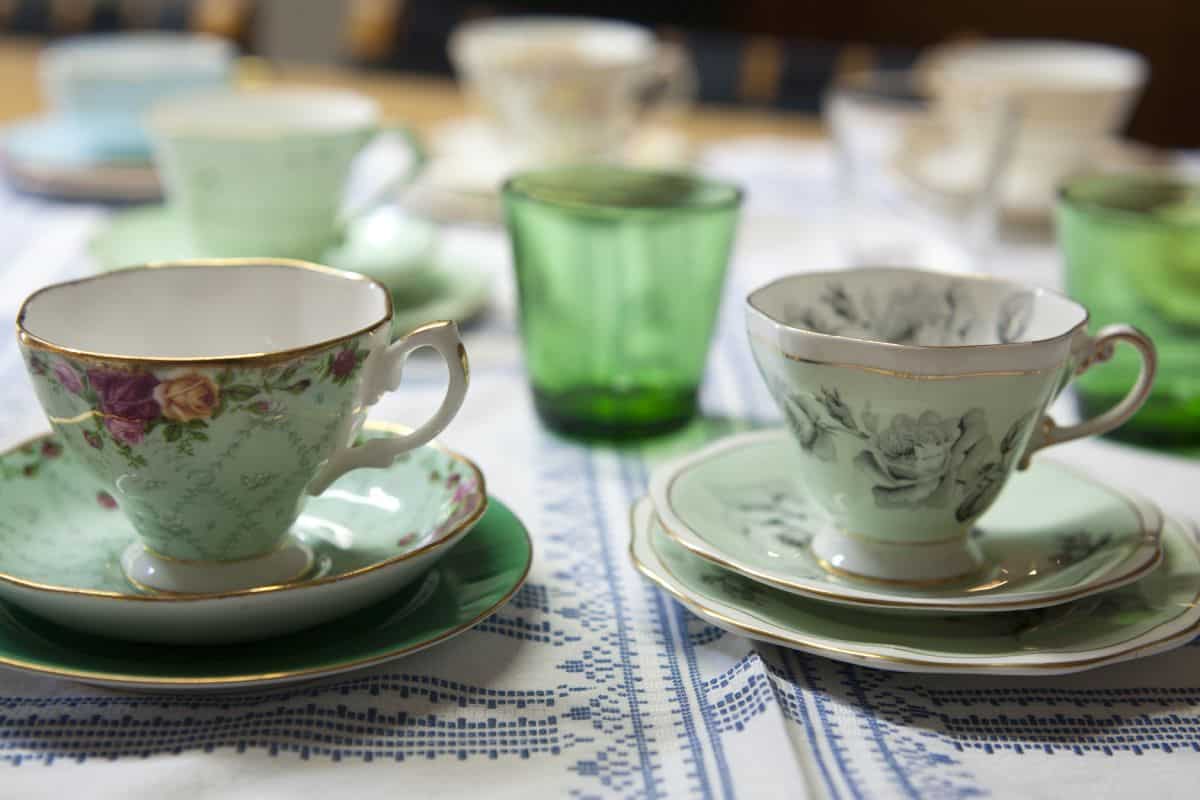 Suzanne Gibbs Balmain house dining room table laid with glasses, tea set and platters