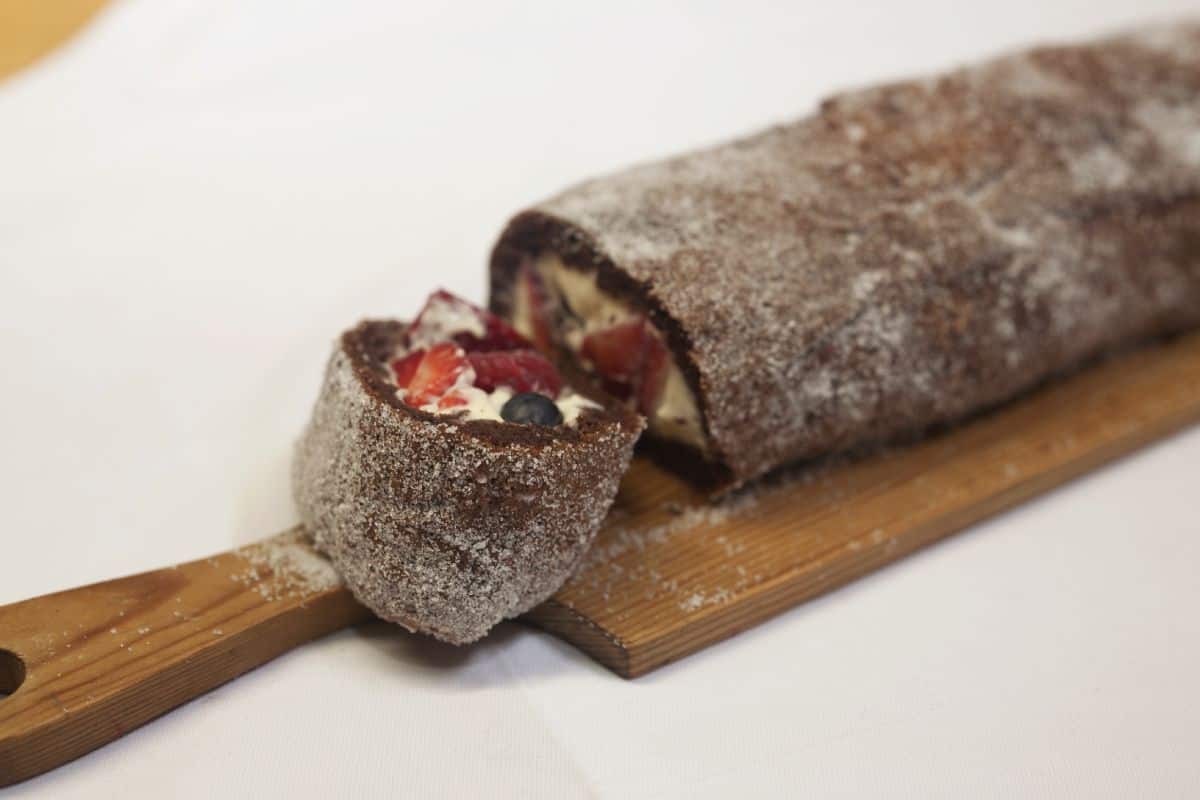 Chocolate roulade with berries and cream made by Suzanne Gibbs